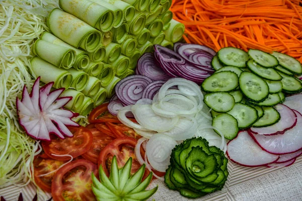 Variety of carving vegetables .Fruit and vegetable carving . Food decoration. Vegetable flowers .Variety of carving vegetables