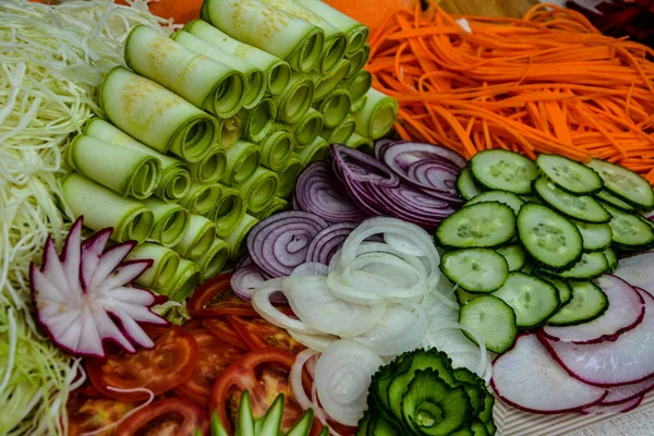 Variety of carving vegetables .Fruit and vegetable carving . Food decoration. Vegetable flowers .Variety of carving vegetables