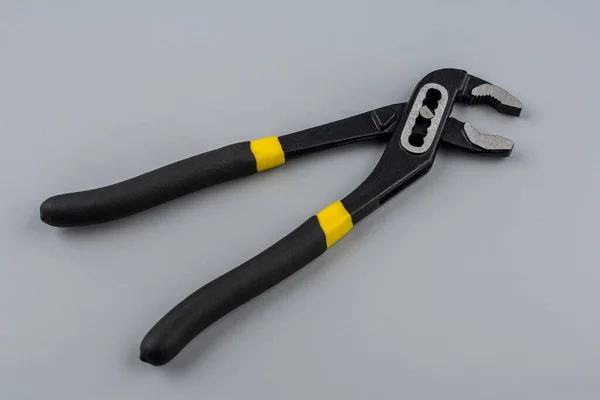 Metal Hand Work Tool Opened Jaws Yellow Plastic Handles Holding — Stock Photo, Image