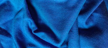 Mavi kumaştan katlanmış arka plan. Kumaşın dokusu. mavi kumaş kumaş arkaplan dokusu .