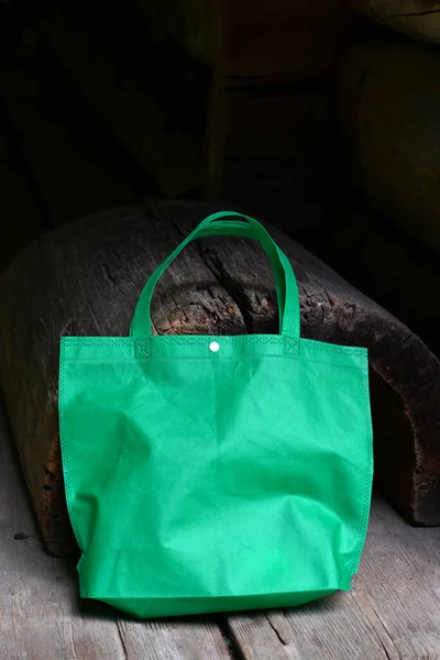green shopping fabric bag .Carrying Groceries in Reusable Green Bag .