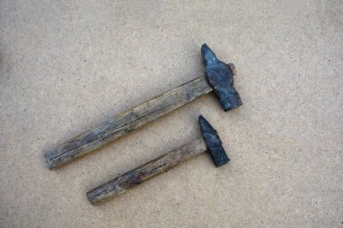 Many old hammers in carpenter's workshop .Old Hammers on Rustic Wood Background .
