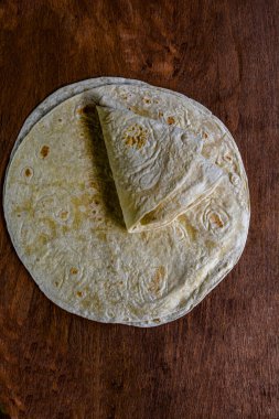Round wheat tortillas close-up.Lavash. Turkish lavash bread. ( Turkish naan bread ) .White Tortillas on a White Background .