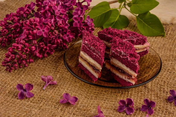 Purple cakes among spring flowers .Purple Taro Cake .