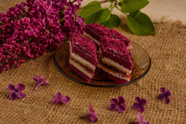 Purple cakes among spring flowers .Purple Taro Cake .