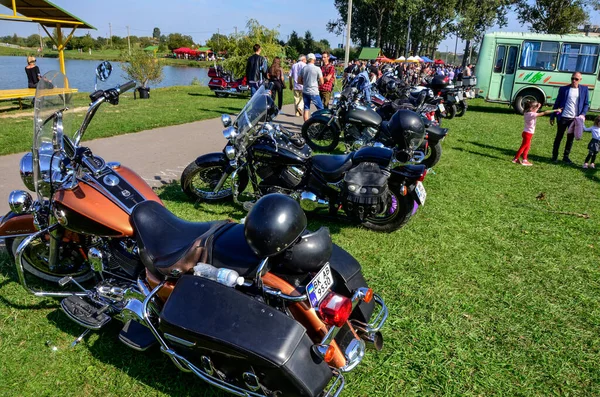 An exhibition of sports motorcycles lined up in a row .Cool bikers festival, exhibition. Chrome motorcycle engine block close up. Motorbike on the road.