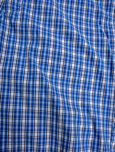 Blue white tartan texture background. shirt fabric with a checkered pattern. factory material