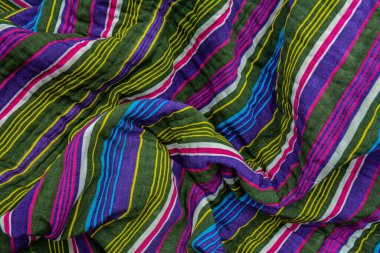 typical central asian striped decor of fabric .National Uzbek men's striped clothing.