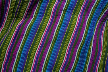 typical central asian striped decor of fabric .National Uzbek men's striped clothing.