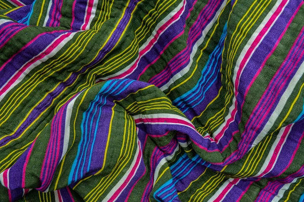 typical central asian striped decor of fabric .National Uzbek men's striped clothing.