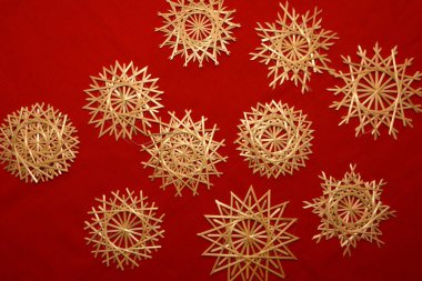 Very beautiful snowflakes woven from rye straw. Folk craft traditions.