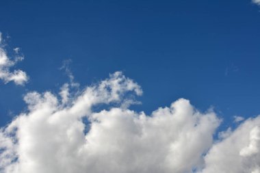 Fluffy white clouds and blue sky.Aerial view on white fluffy clouds .Background from clouds.