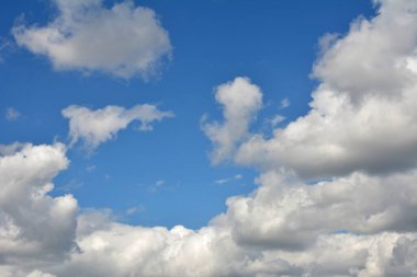 Fluffy white clouds and blue sky.Aerial view on white fluffy clouds .Background from clouds.