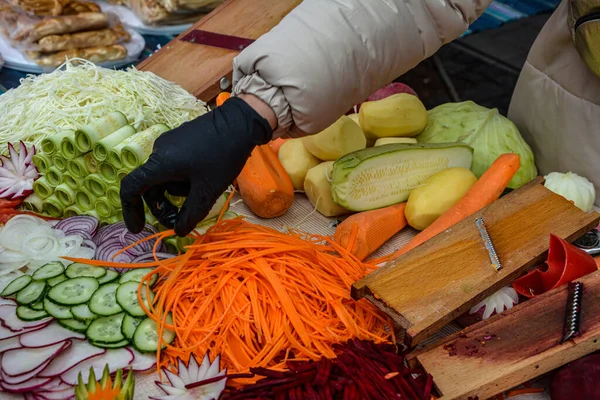 Cut vegetables ready for cooking.Cut vegetables of rainbow colors on wooden cutting board .