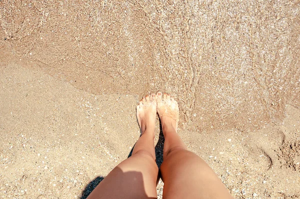 Bare feet Woman girl enjoy water waves splashing relax on summer sea shore,vacation freedom lifestyles