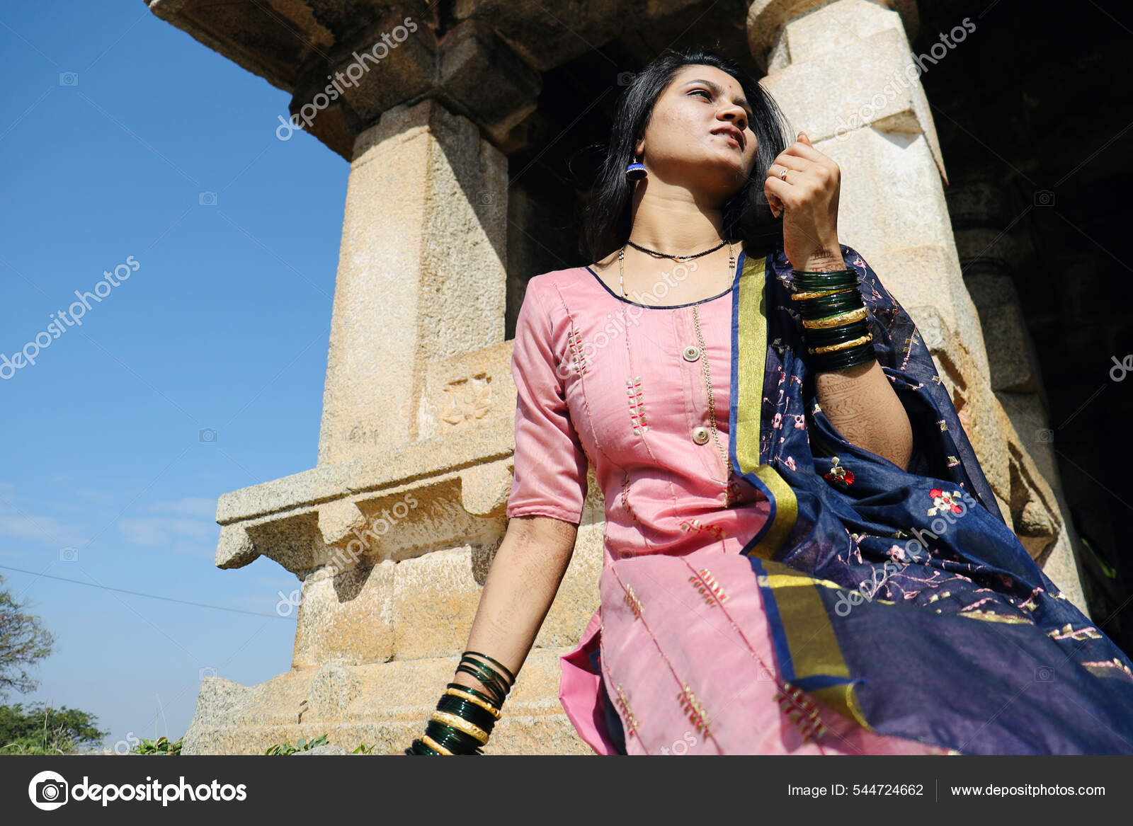 Girl posing against the temple wall - PixaHive
