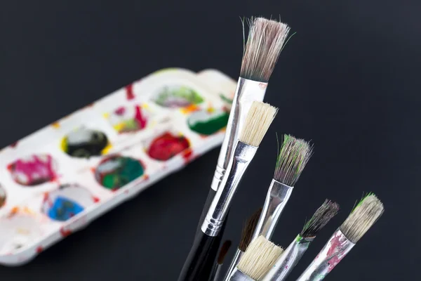 Colors and brushes — Stock Photo, Image