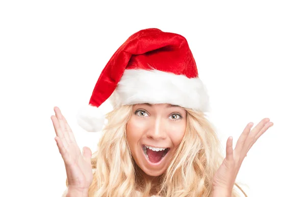 Surprised girl in red santa hat isolated on white. — Stock Photo, Image