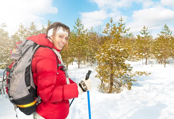 Young woman skiing in forest on winter sunny day. — Stock Photo, Image