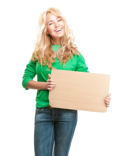 Красива і щаслива молода жінка тримає порожній шматок картону Ліцензійні Стокові Зображення