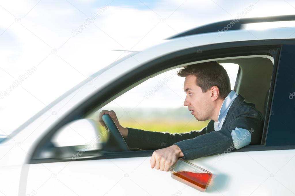 Drunk Man Driving Car With Bottle In Hand Stock Photo Kyolshin