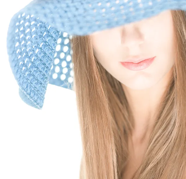 Young woman with half hidden face under blue hat. — Stock Photo, Image