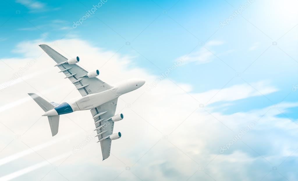 Passenger airplane flying in blue cloudy sky.