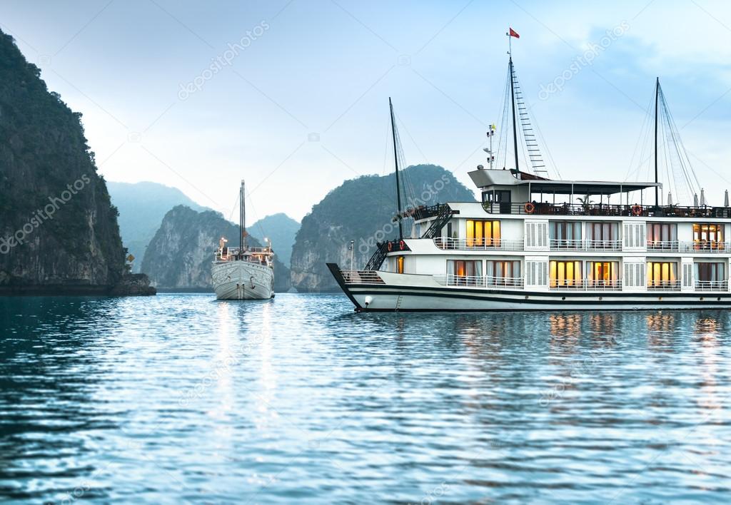 Two ships in beautiful Halong bay, Vietnam, Asia.