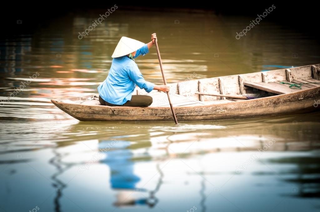Woman on wooden boat in river in Vietnam, Asia. — Stock ...