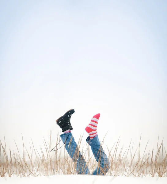 Legs with missing boot in air in winter day. — Stock Photo, Image