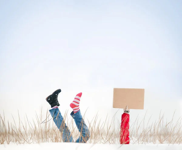 Legs with missing boot in air on winter day. — Stock Photo, Image