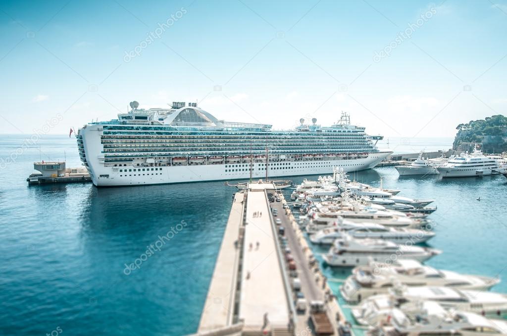 Large luxurious cruise ship in sea port.