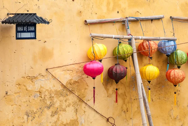 Different lanterns near wall — Stock Photo, Image