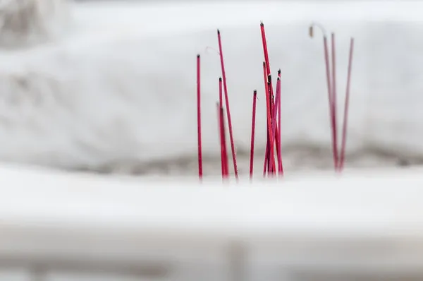 Burning red sticks for worship in buddhist temple. — Stock Photo, Image