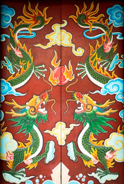 Colorful door with symmetrical dragon painting — Stock Photo, Image