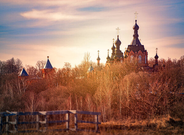 Old russian monastery with blue cloudy sky in background