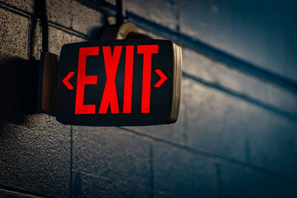 Glowing Exit Sign Night Black Wall — Stock Photo, Image