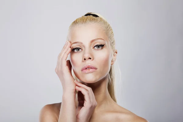 Young pretty woman with beautiful blond hairs on white background — Stock Photo, Image