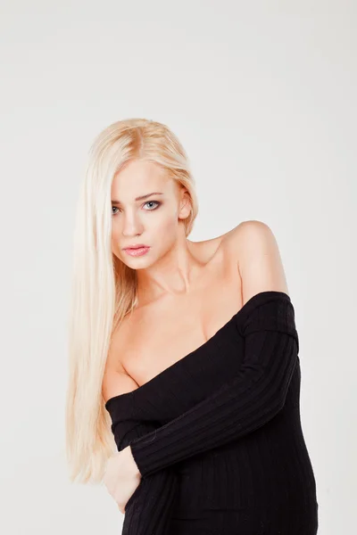 Ung vacker sexig blond tjej på vit bakgrund — Stockfoto