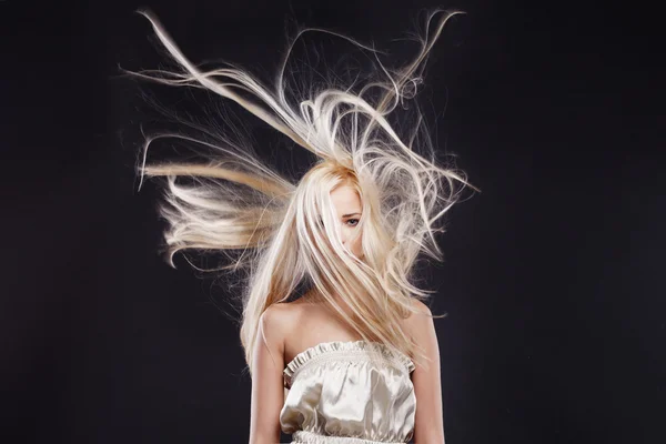 Fashion Portrait of beautiful blonde with the flying hair — Stock Photo, Image