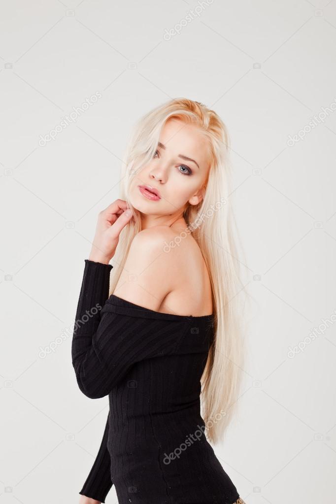 Young beautiful sexy blond girl on white background