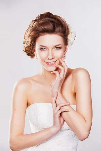 Young smiling bride with beautiful hairstyle — Stock Photo, Image