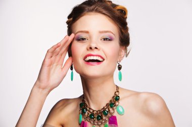 Beautiful woman with perfect makeup wearing jewelry clipart