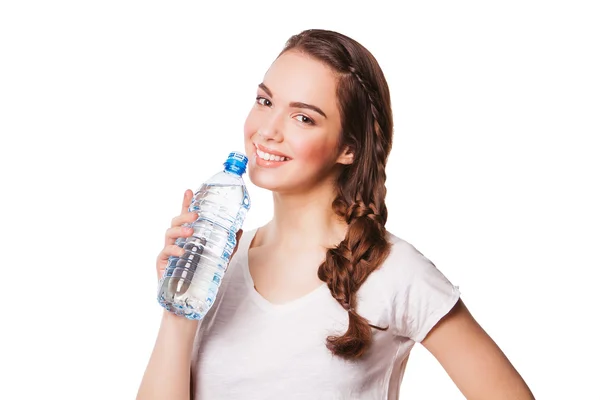 Beautiful girl drinking water from blue bottle — Stock Photo, Image