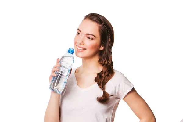 Beautiful smiling woman drinking water from bottle — Stock Photo, Image