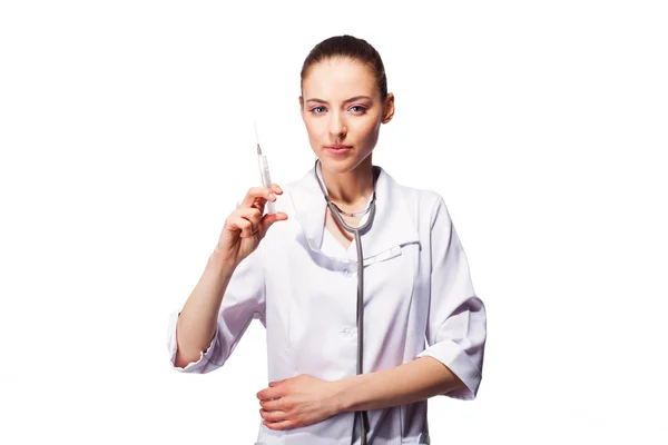 Smiling beautiful medical doctor woman with syringe. Isolated over white background. — Stock Photo, Image