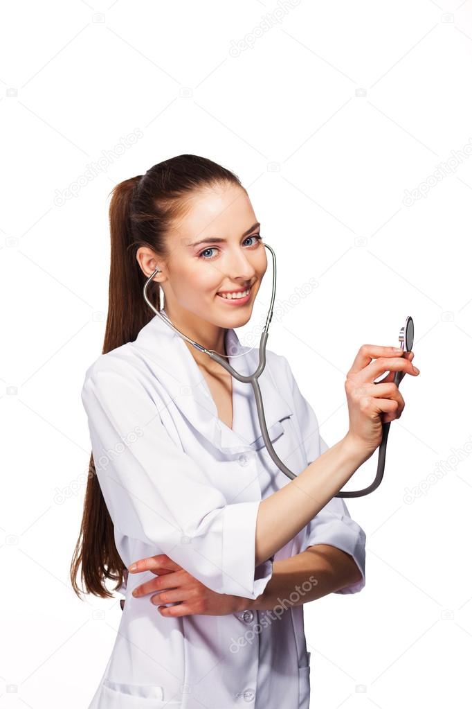 Smiling friendly doctor woman with stethoscope. Isolated over white background.
