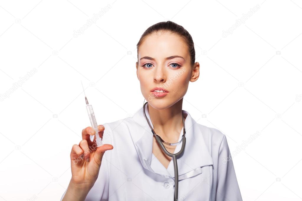 doctor woman with syringe. Isolated over white background.