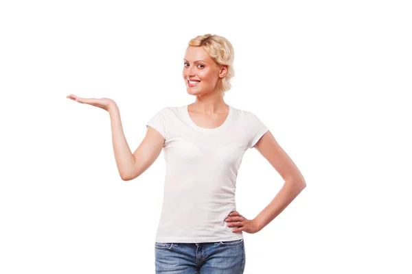 Happy woman wearing whote t-shirt, holding something on the palms — Stock Photo, Image