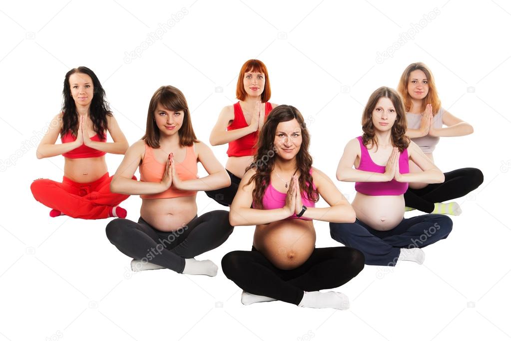 group of six smiling pregnant women doing yoga. isolated on white